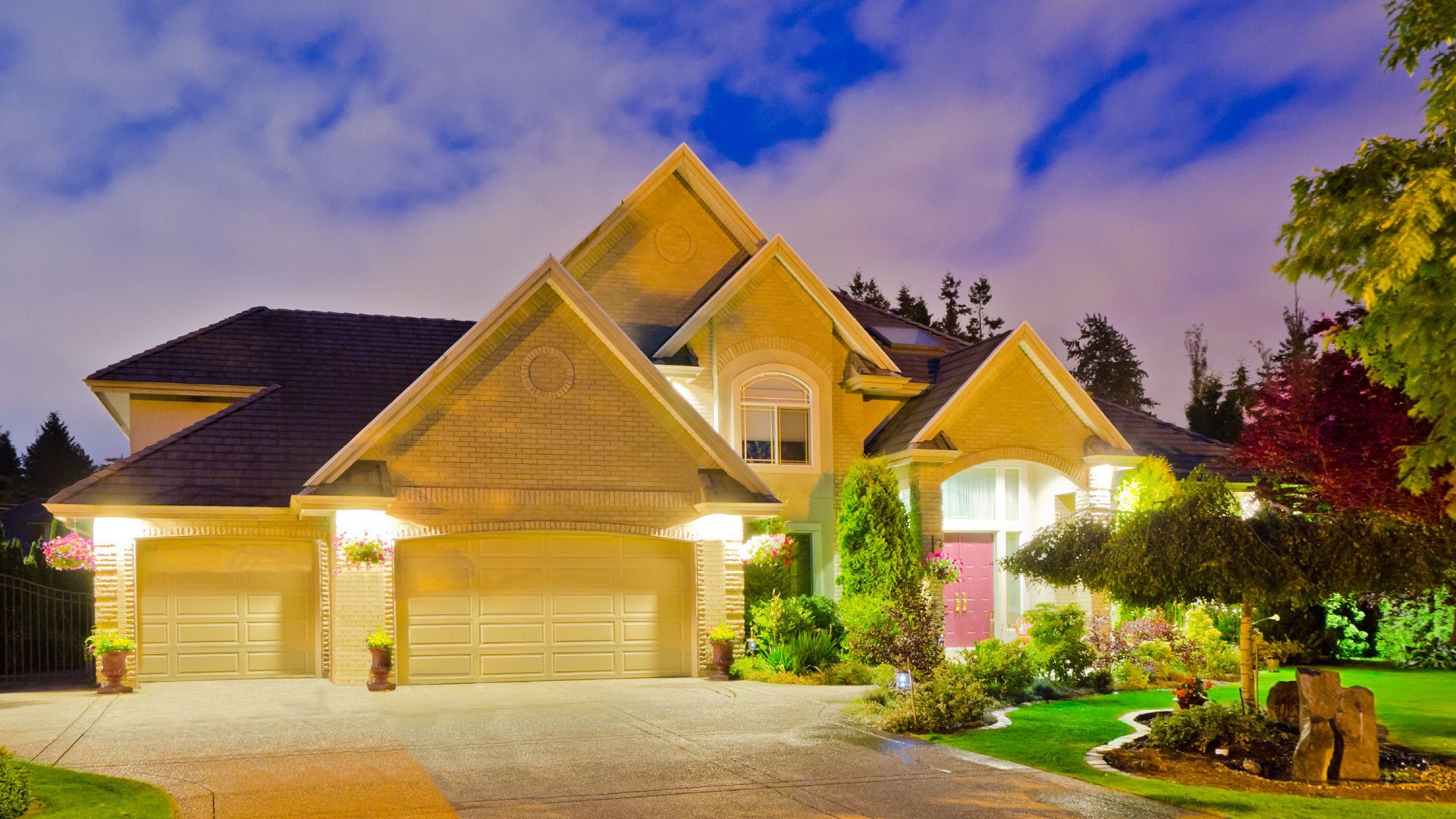 Image of the outside of a home with lights on